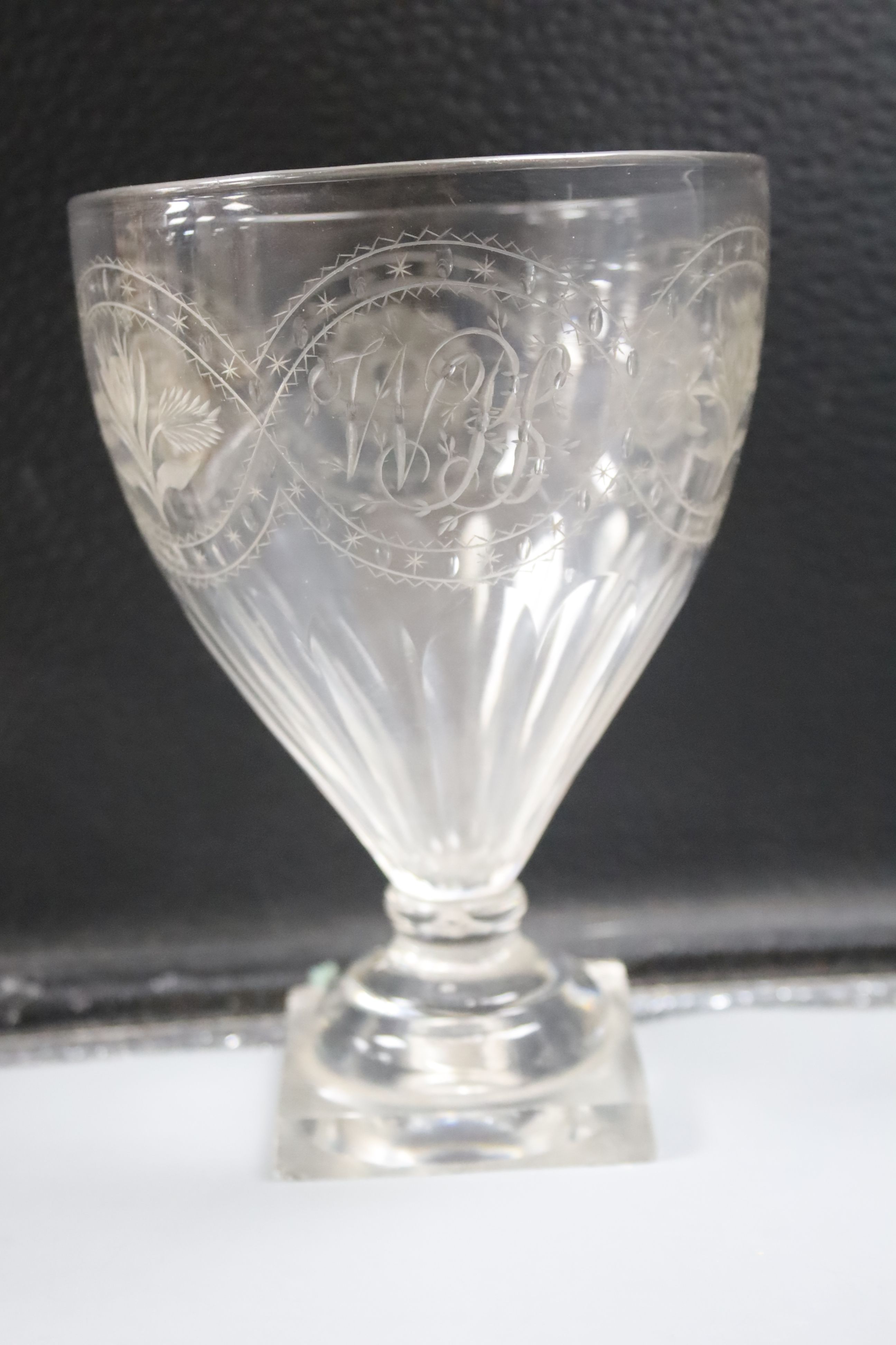 Four 18th century sweetmeat glasses, two with applied blue cable, a George III rummer and an 1842 commemorative goblet